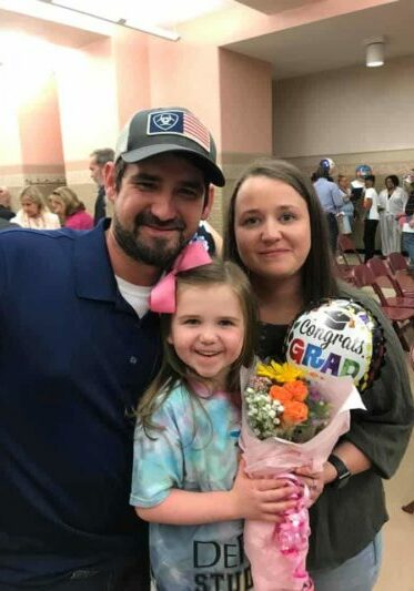 Anna with her mom and dad